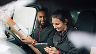 man-and-women-in-delivery-truck