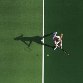 birds eye view of woman playing tennis