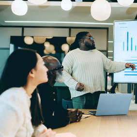 Man Presenting at a Screen